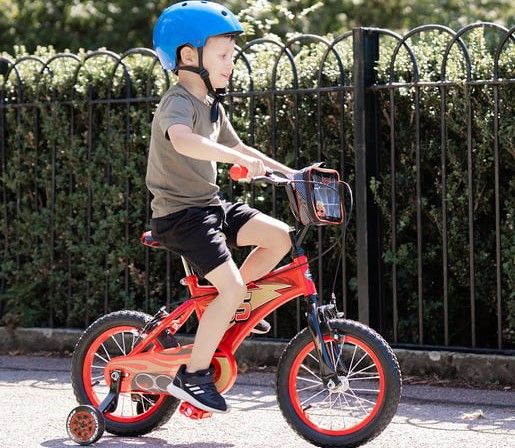 Little boy riding bike.