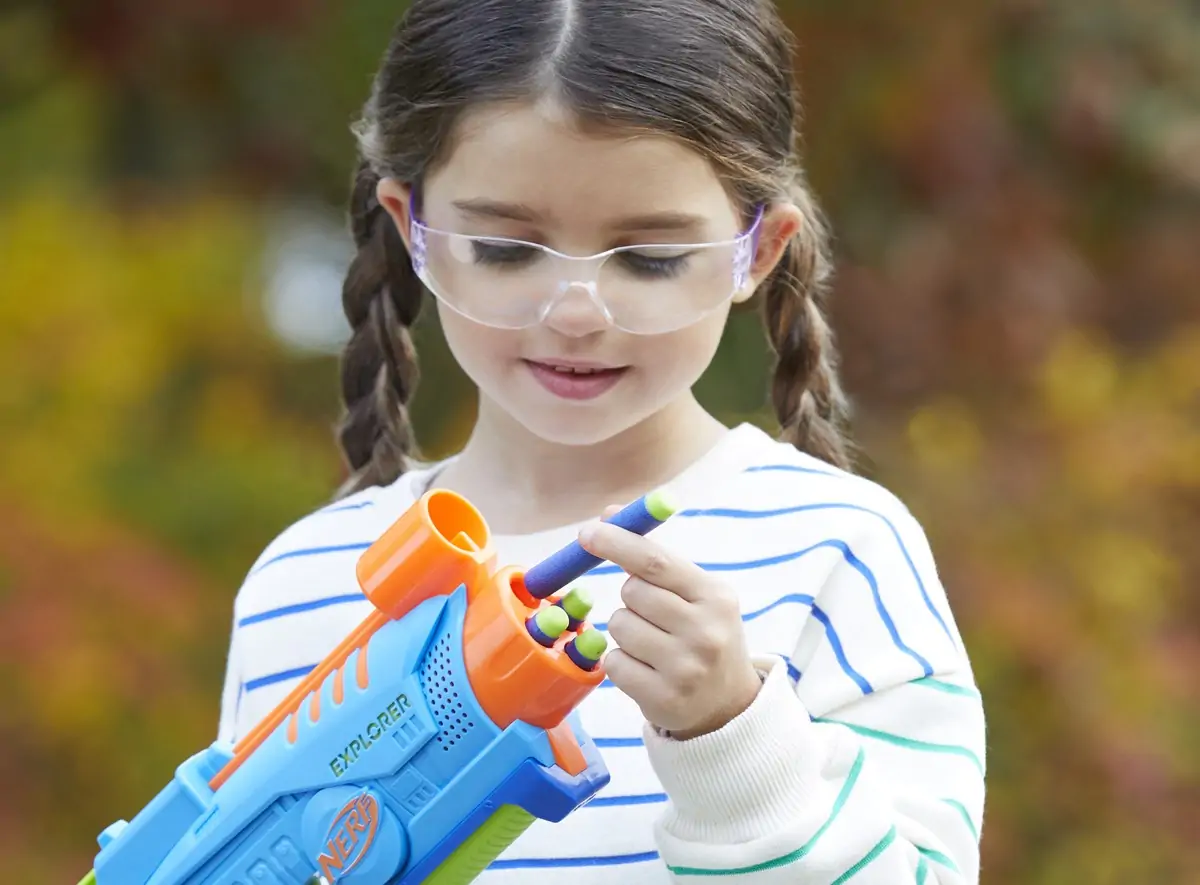 Child with nerf blaster.