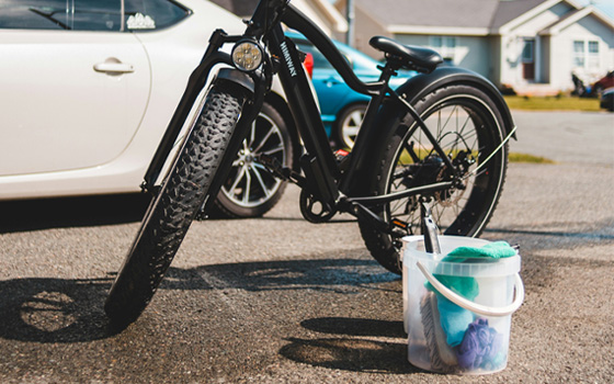 Bike with a cleaning bucket