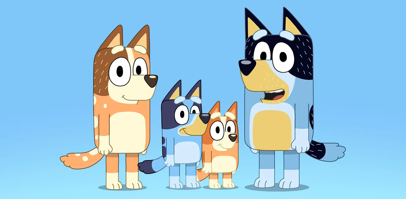 Bluey, Bingo, Bandit and Chilli all standing together as a family