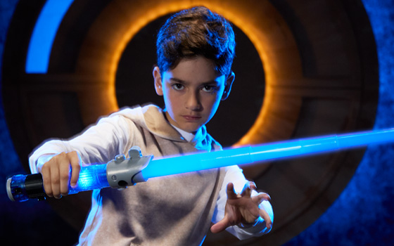 Boy Holding A Lightsaber
