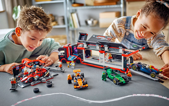 Children playing with LEGO City construction sets