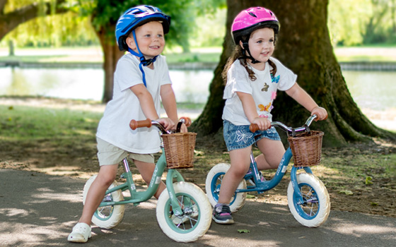 Children riding balance bikes
