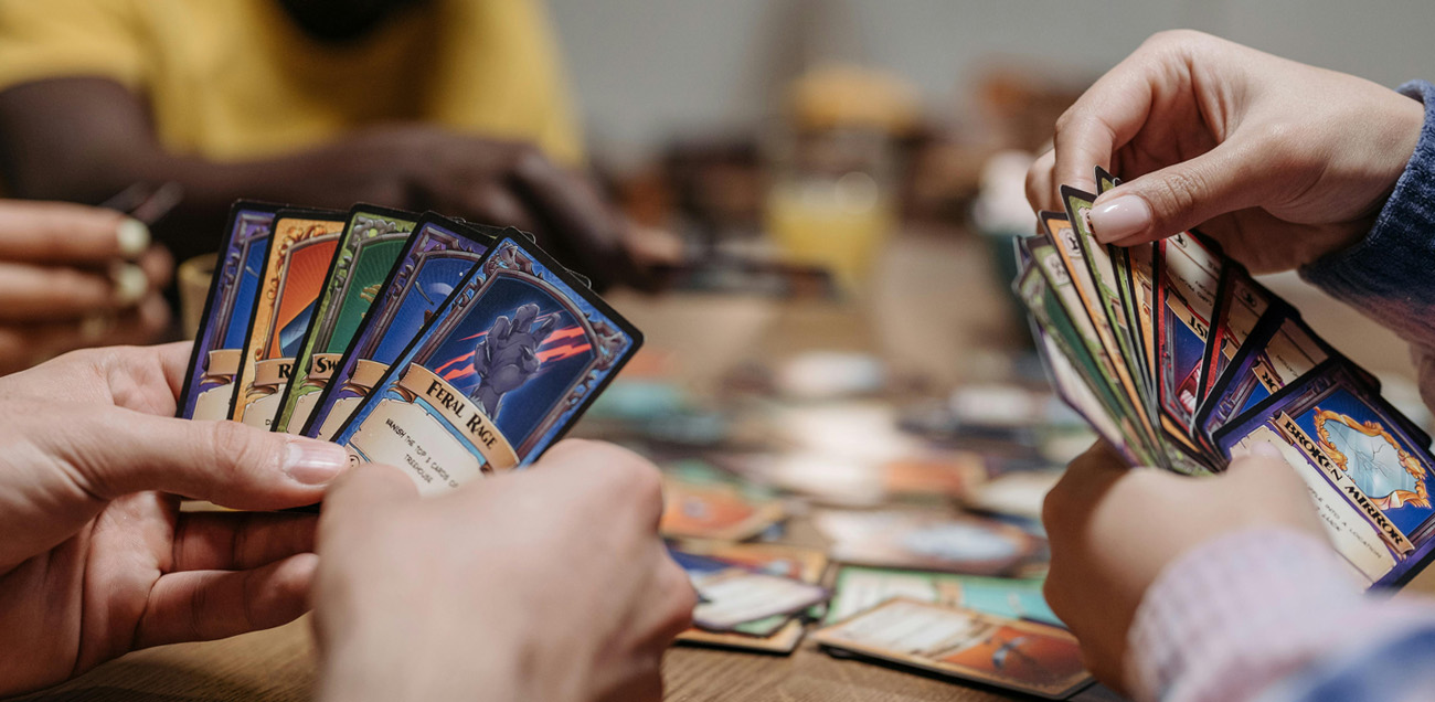 Close up of people playing a trading card game