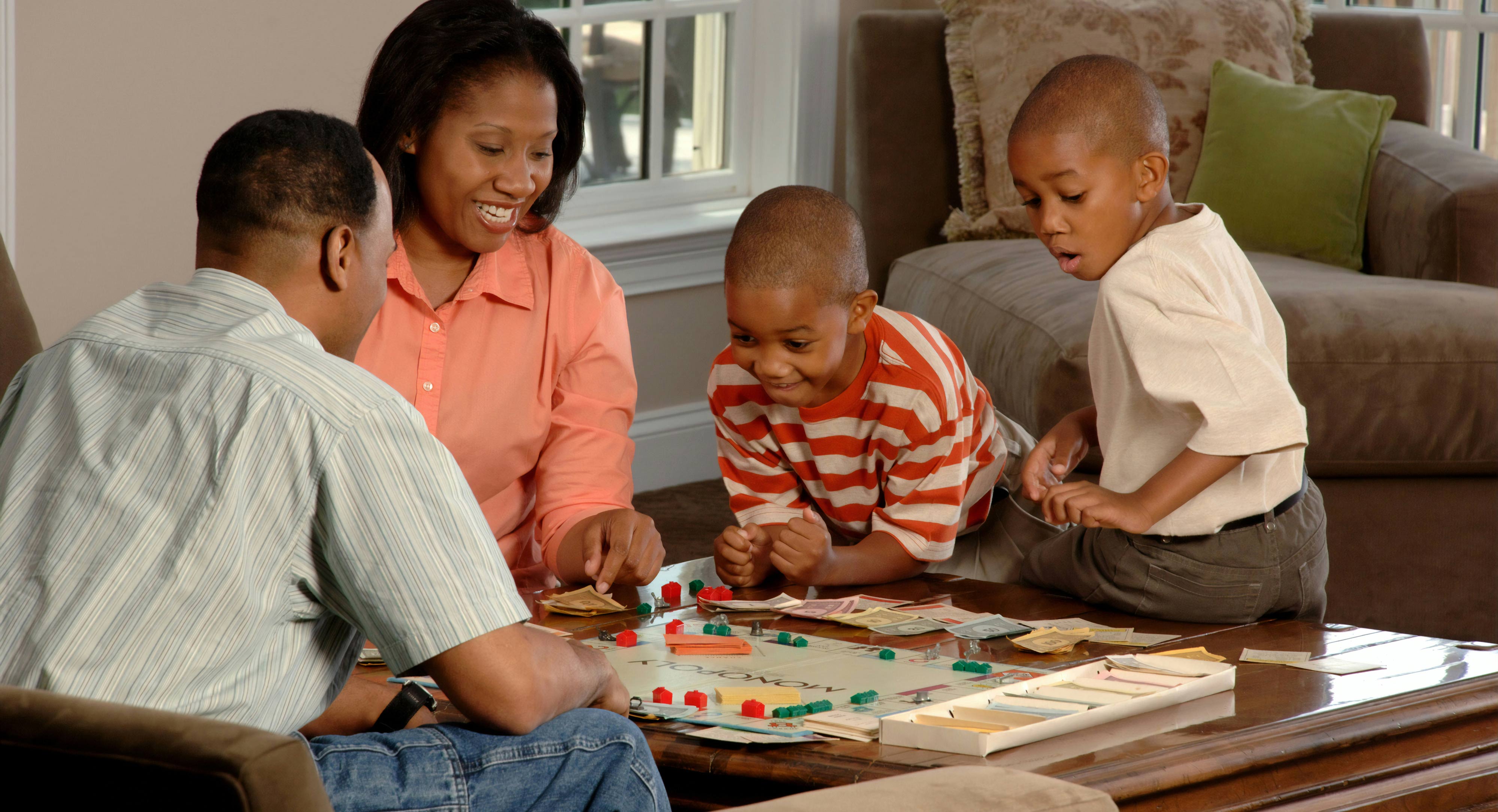 Family playing board game