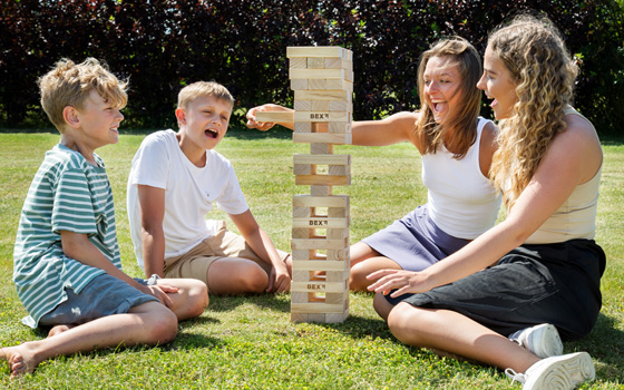 Family playing a tower garden game