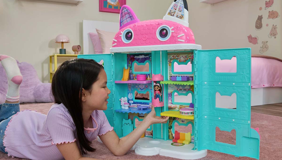 girl-playing-with-gabbys-dollhouse-playset