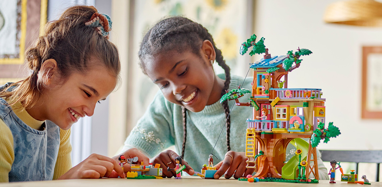 Girls building LEGO Friends set