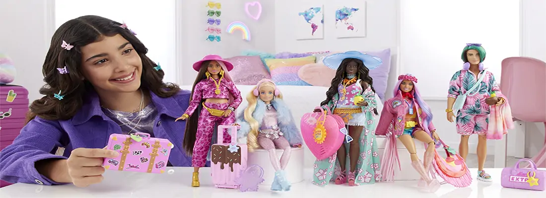 A girl plays with Fashionista Barbies