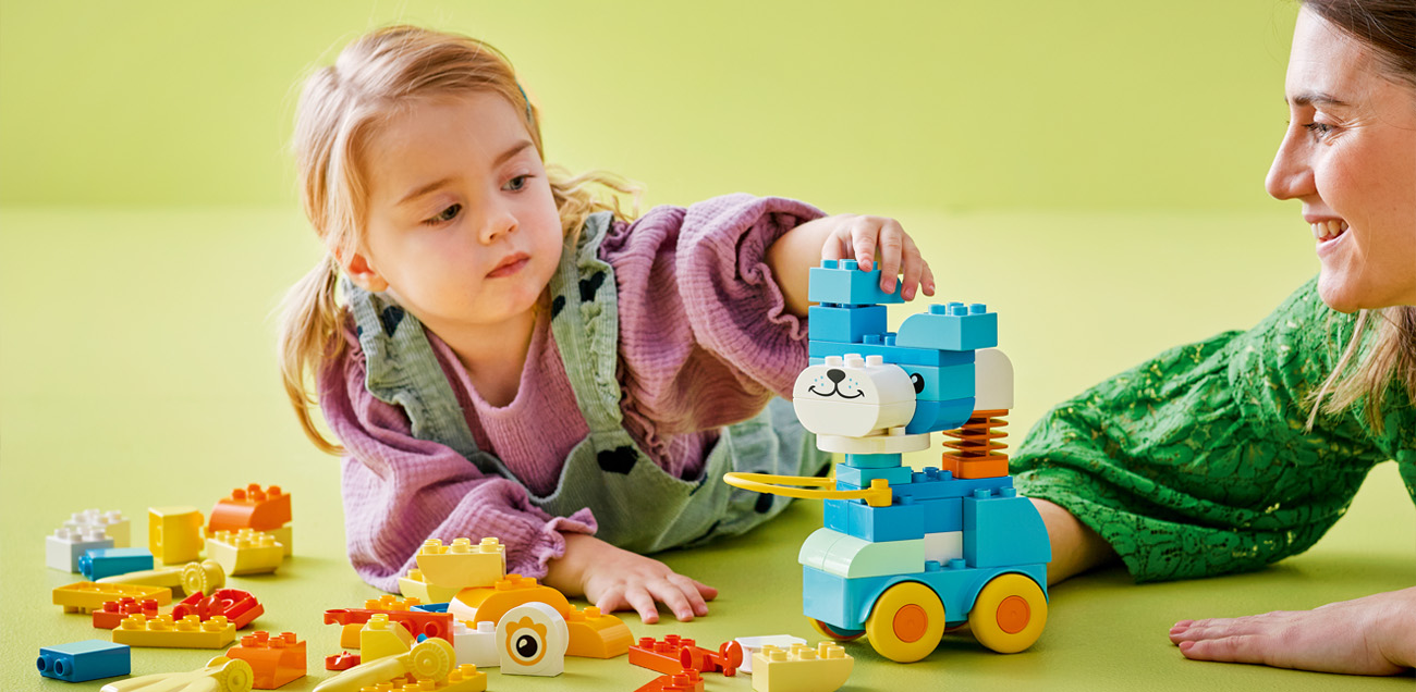 Mother and daughter playing with LEGO