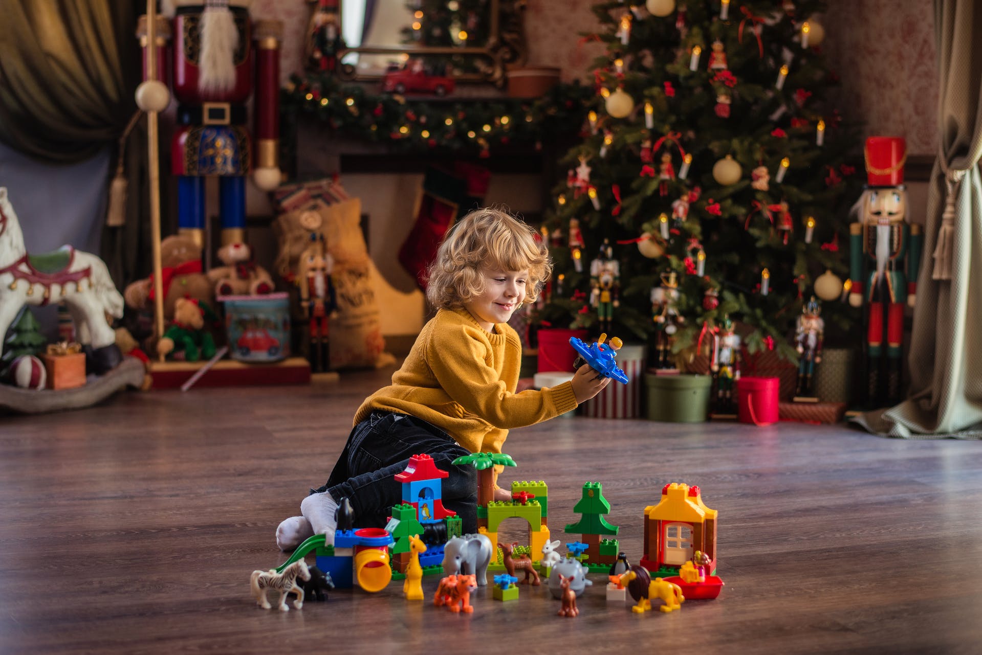 Child plays with construction toys.