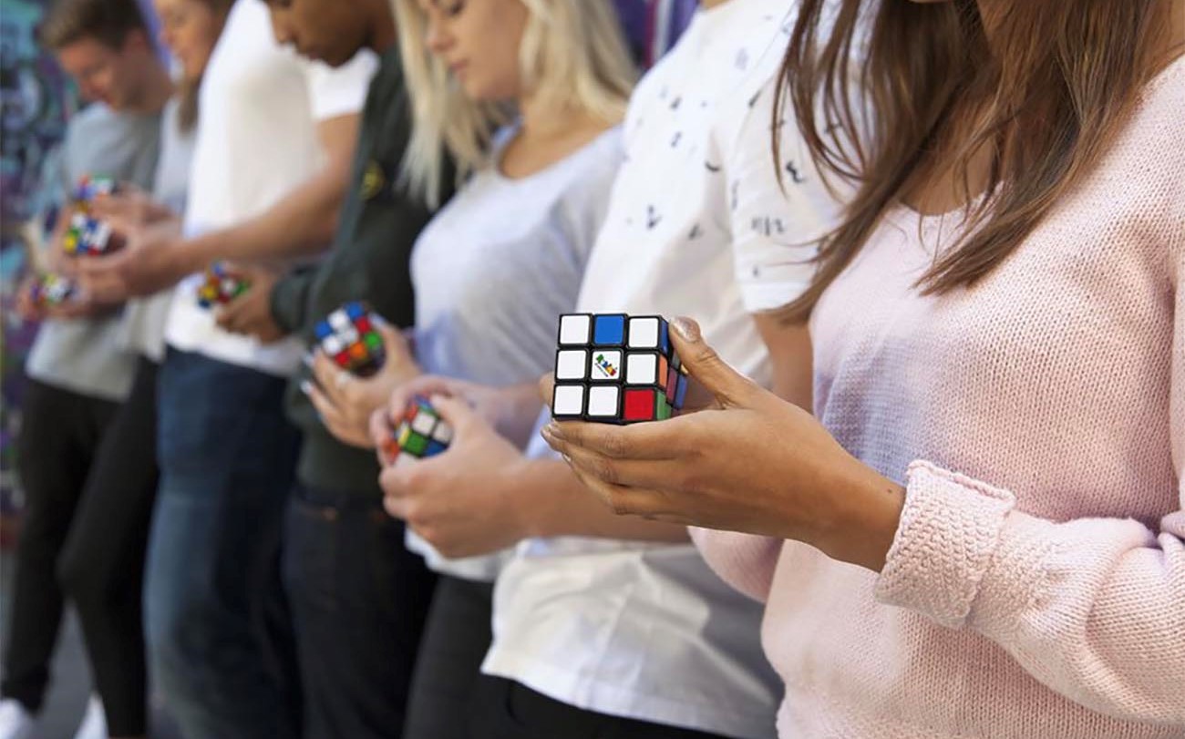 Children play with rubik cubes