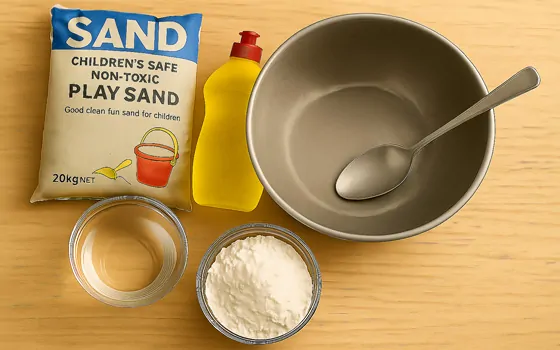Sand, oil, water, flour and dish soap next to a mixing bowl
