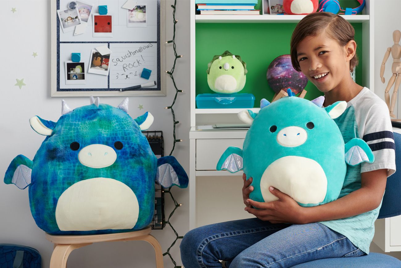 Child with squishmallows.