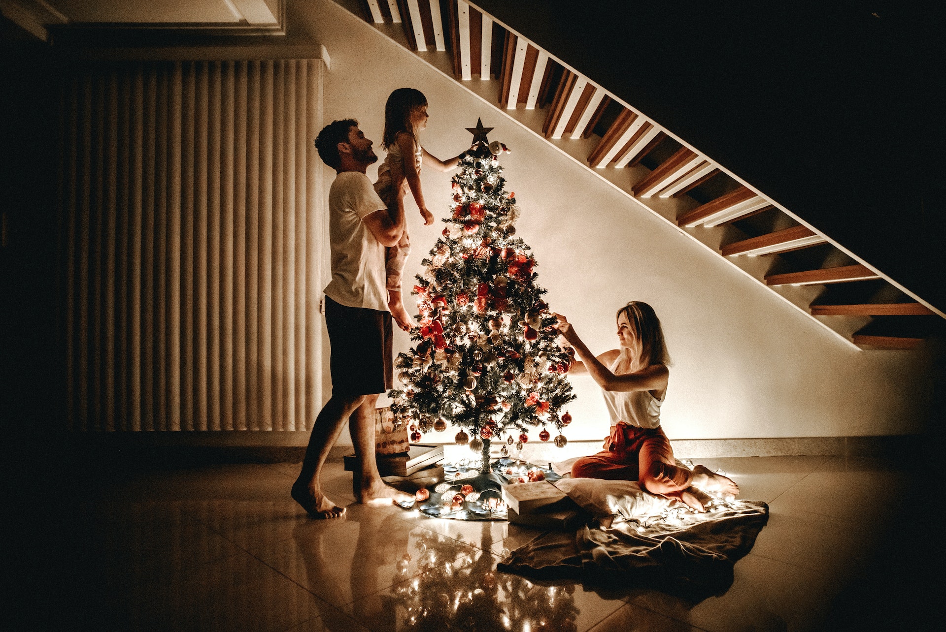 Family preparing christmas tree.