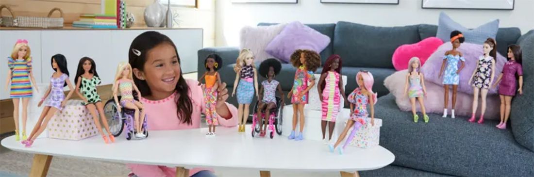 child with barbie fashionistas dolls