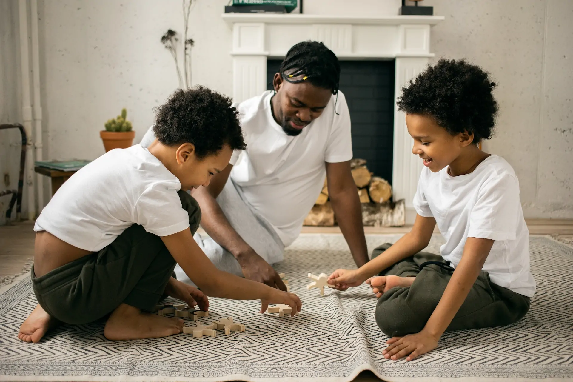 Boy splaying with dad with toys.