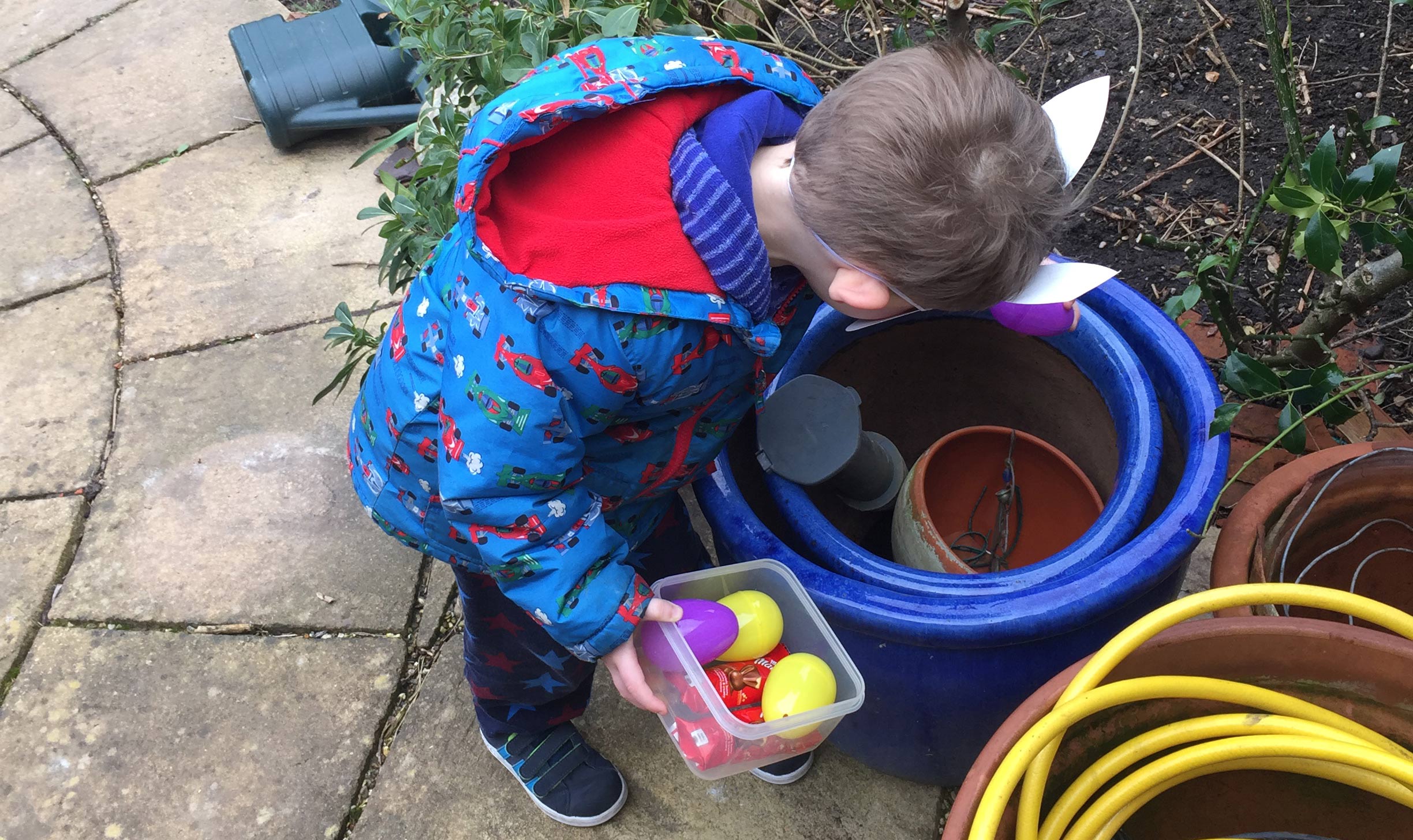 child collecting easter eggs