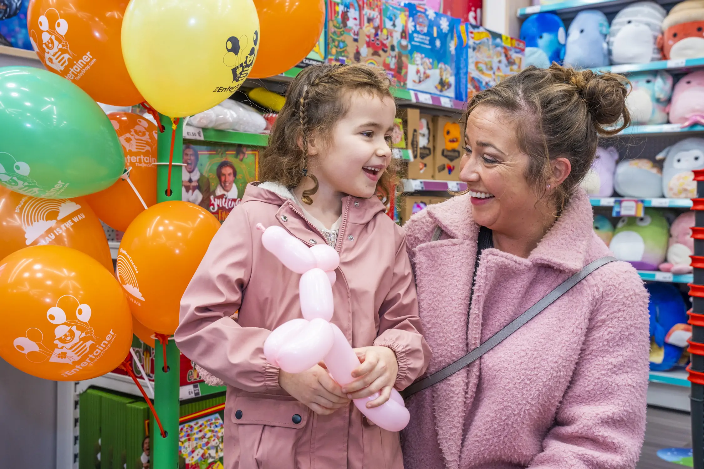 Child and parent at The Entertainer Store.