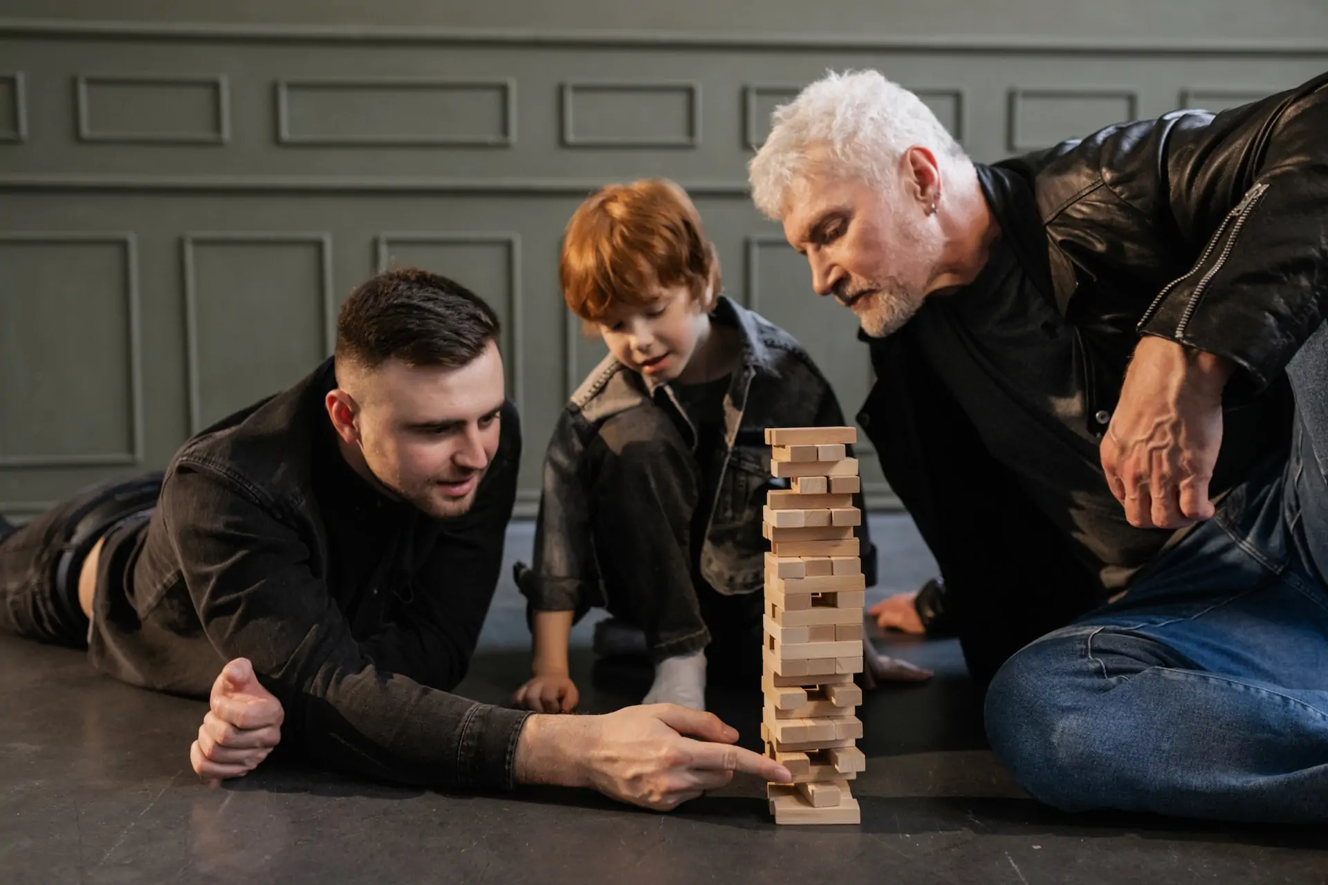 Family plays Jenga together.