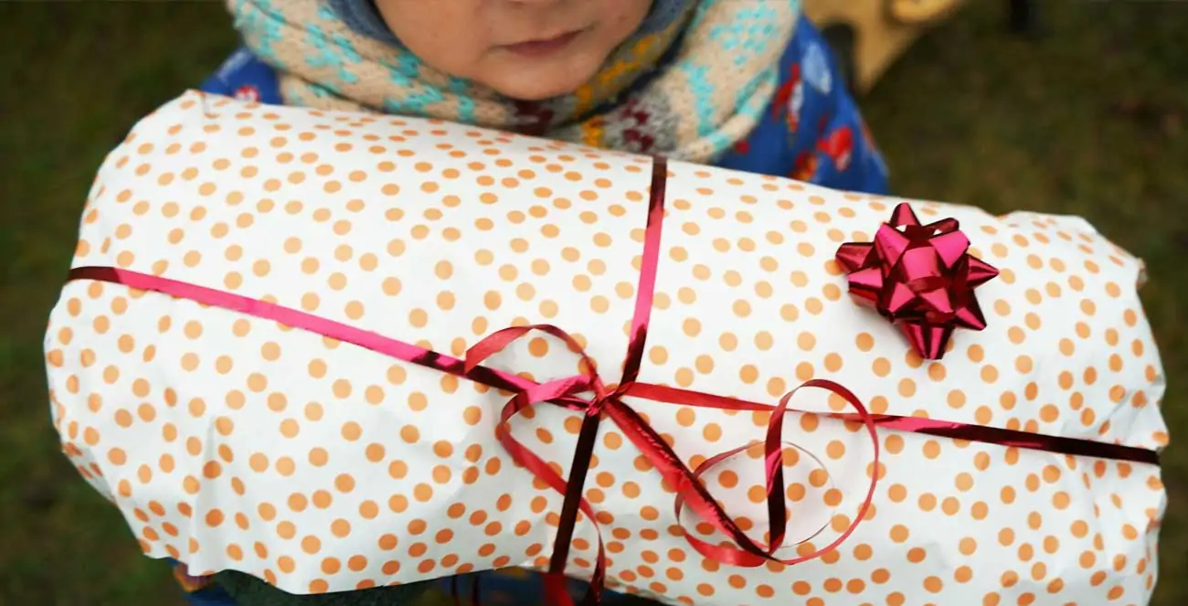 child holding present