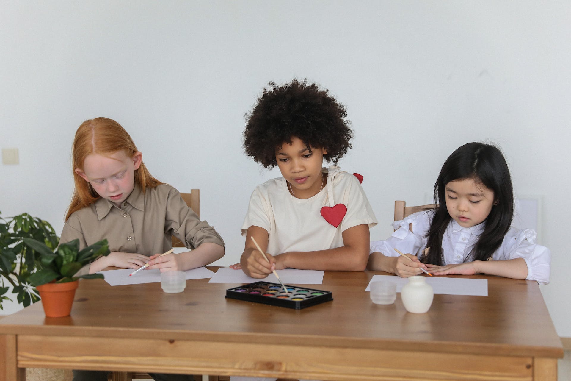 Kids painting together.