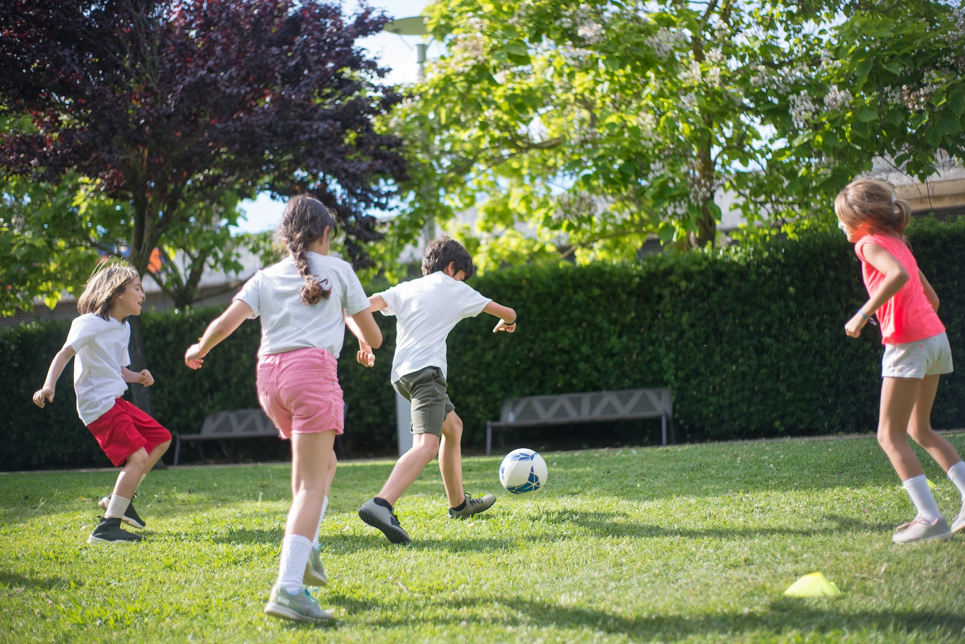 Kids play football in garden