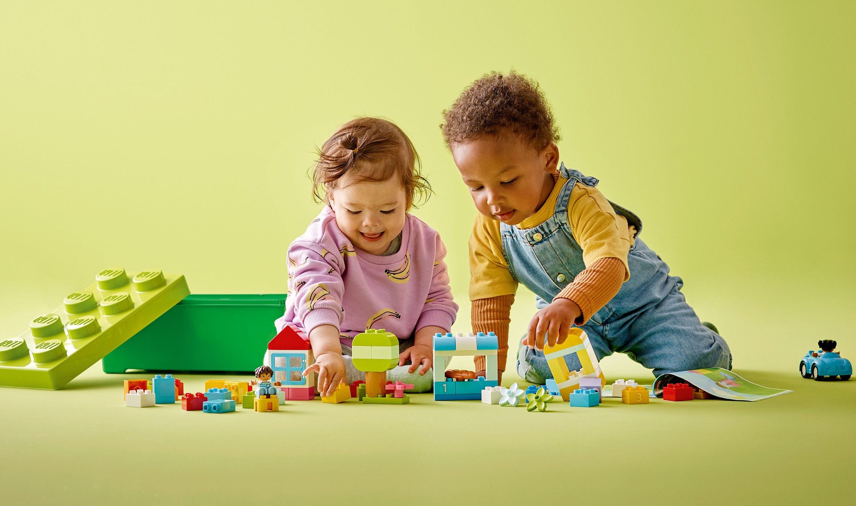 Kids play with LEGO bricks.