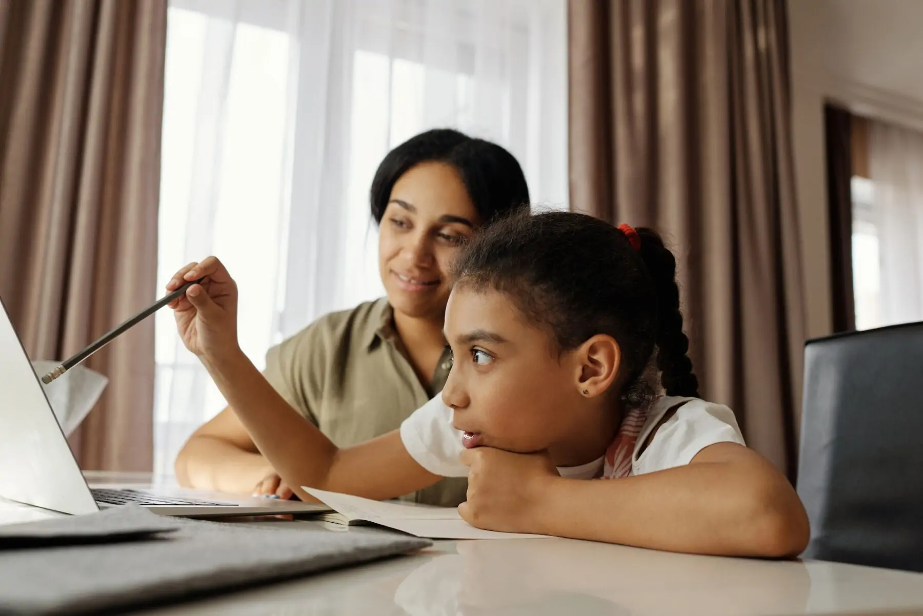 Mum and daughter study.