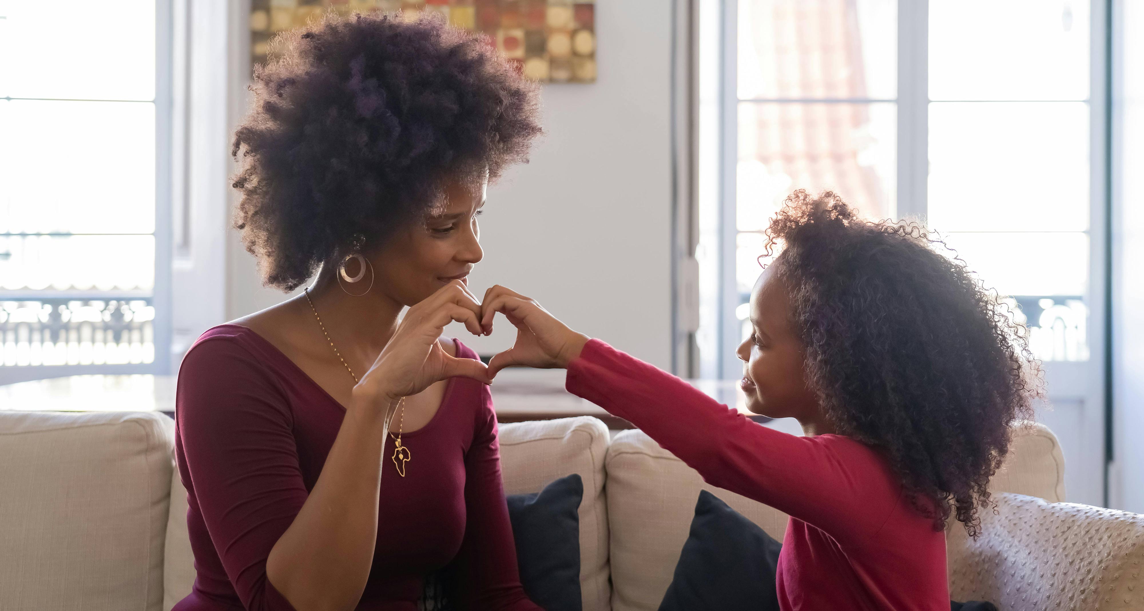 Family making heart with hands