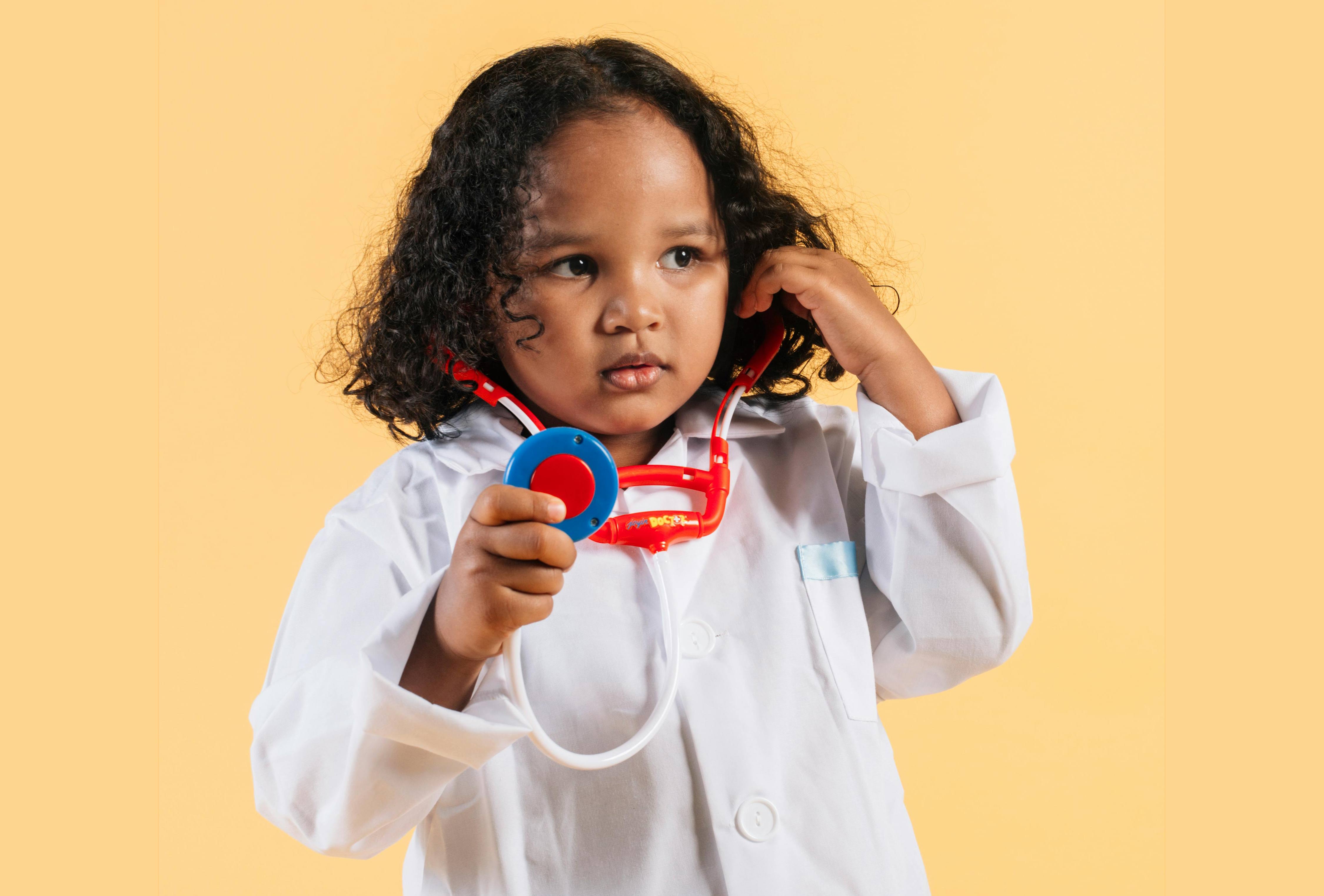 little girl dressed as a doctor