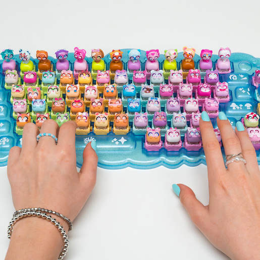 Hands typing on a Clickees keyboard detail view